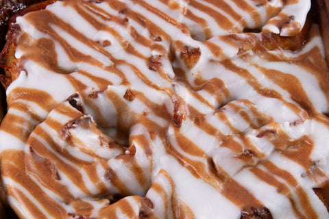 egan apple cinnamon rolls with vanilla glaze drizzle, featuring real apple pieces and warm spices, gluten-free and kosher certified