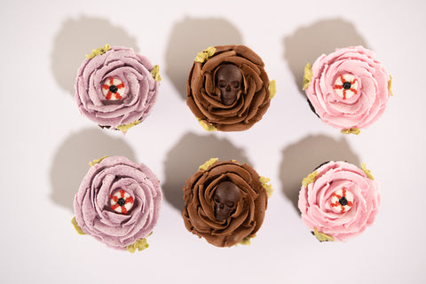Halloween cupcakes with buttercream flowers and skulls.