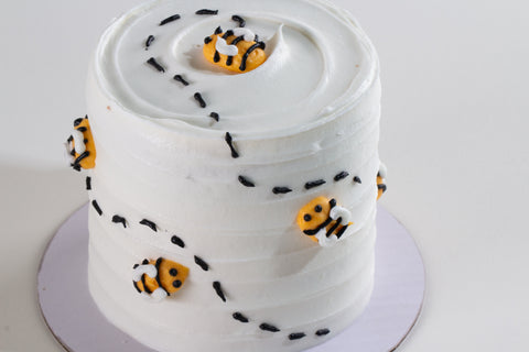 3-inch vegan honey apple cake with white frosting and handcrafted bee decorations, perfect for Rosh Hashanah celebrations