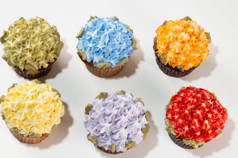A garden of color for Pride Month. Our Pride Florals Cupcakes are topped with lush, bloom-style frosting in six rainbow hues — each one a little work of art. Sage green leaf accents add the finishing touch to this limited-edition seasonal treat. Vegan, gluten-free, and made to be shared.
